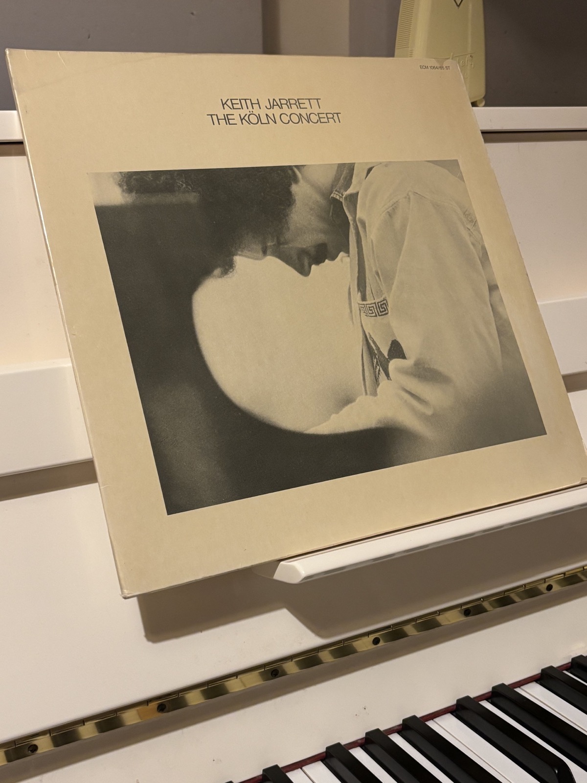 Keith Jarrett — The Köln Concert ECM vinyl on a turntable; tonearm over the record in a home listening setup