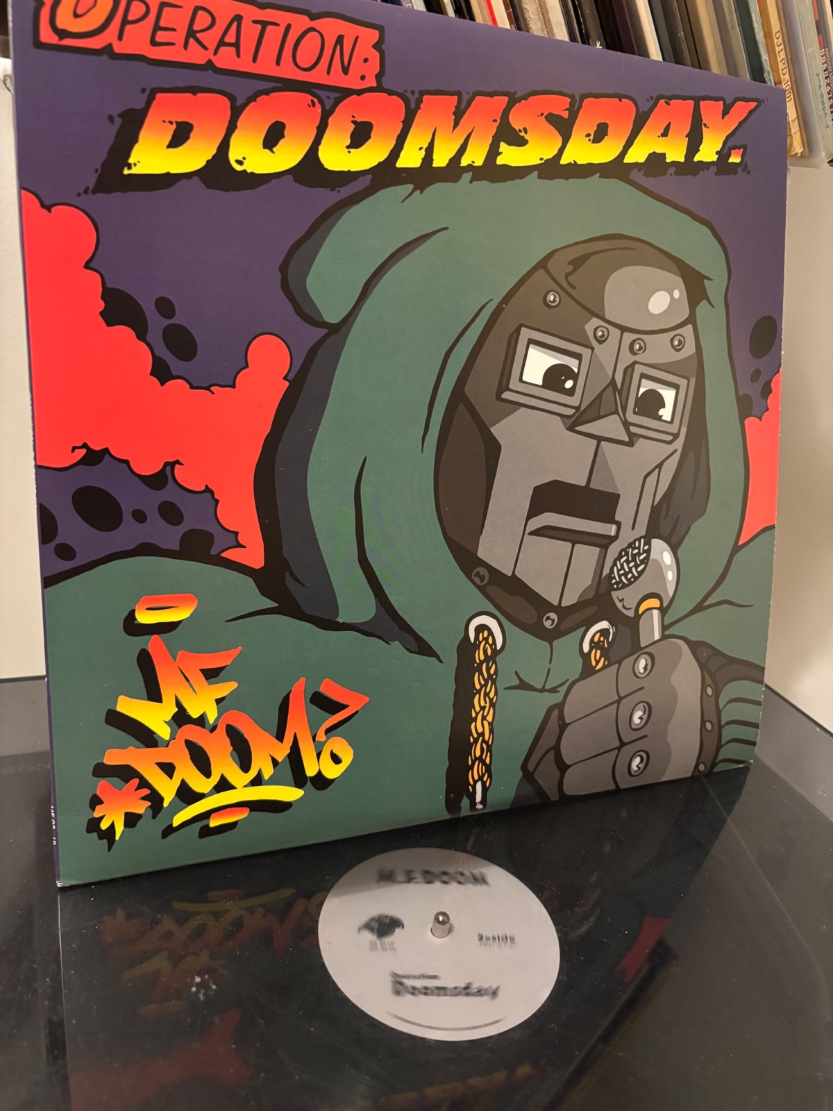 MF Doom Operation Doomsday vinyl on a turntable; independent hip-hop LP in a collector listening setup